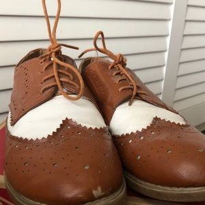 brown and white loafers